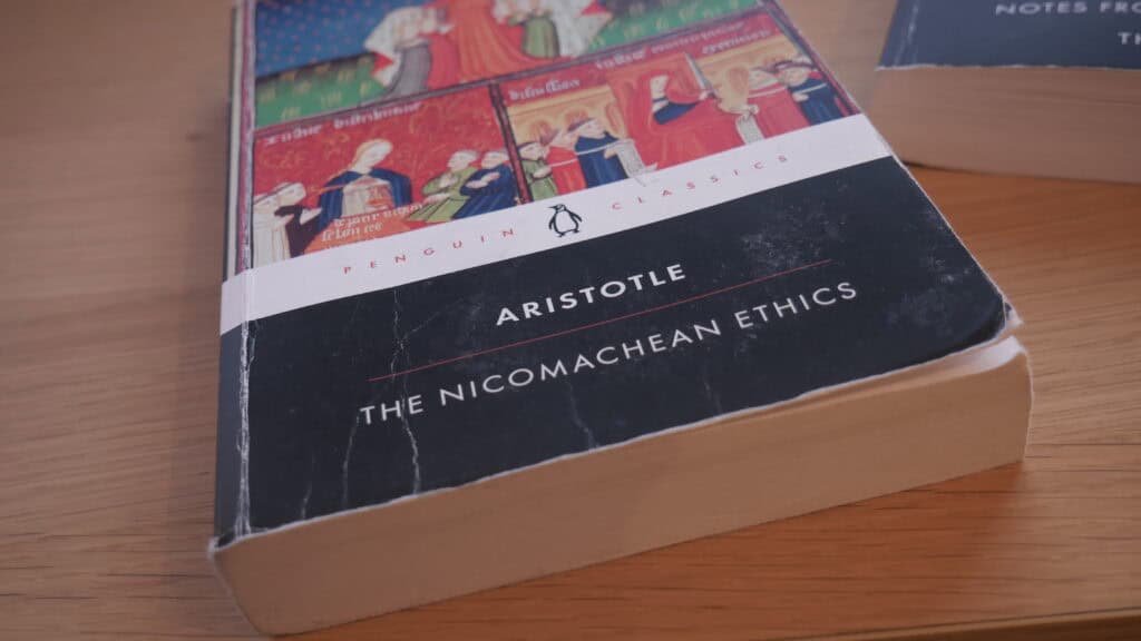 Picture of Aristotle's The Nicomachean Ethics on a desk.